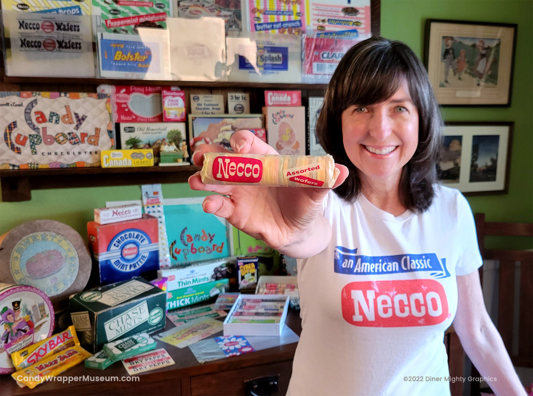 Darlene Lacey of the Candy Wrapper Museum holds a roll of Necco wafers, which were once made in Cambridge, Massachusetts. Behind her are Necco related artifacts from her Candy Wrapper Museum.